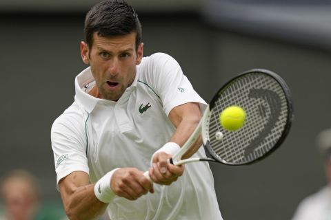 Serbia's Novak Djokovic returns to Korea's Kwon Soonwoo in a men's first round singles match on day one of the Wimbledon tennis championships in London, Monday, June 27, 2022. (AP Photo/Kirsty Wigglesworth)