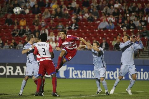 FRISCO, TX - OCTOBER 17:  John George #14, and Ugo Ihemelu #3 of the FC Dallas prepares to head the ball past Colorado Rapids defenders Jordan Harvey #2, Dew Moor #3 and Pablo Mastroine #25 for a goal at Pizza Hut Park on October 17, 2009 in Frisco, Texas.  (Photo by Rick Yeatts/MLS via Getty Images)