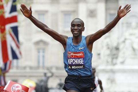 FILE - In this Sunday, April 26, 2015 file photo, Eliud Kipchoge of Kenya wins the Men's race in the 35th London Marathon. On the 63rd anniversary of Roger Bannister breaking the four-minute mile, three elite athletes will attempt to do something arguably more extraordinary, run the first sub-two-hour marathon. Olympic marathon champion Eliud Kipchoge leads the attempt on Saturday, May 6, 2017 at Monza's Formula One racecourse, along with two-time Boston Marathon winner Lelisa Desisa, from Ethiopia, and Eritrean half-marathon world-record holder Zersenay Tadese. (AP Photo/Kirsty Wigglesworth, File)