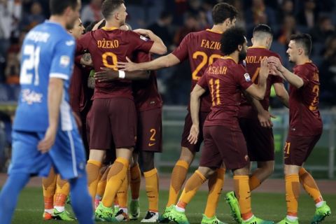 Roma's Edin Dzeko, third from left, celebrates with teammates after scoring during a Serie A soccer match between Roma and Empoli, at the Rome Olympic stadium, Saturday, April 1, 2017. (AP Photo/Alessandra Tarantino)