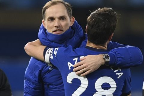 Chelsea's head coach Thomas Tuchel embraces Chelsea's Cesar Azpilicueta at the end of the English Premier League soccer match between Chelsea and Everton at the Stamford Bridge stadium in London, Monday, March 8, 2021. (Mike Hewitt/Pool via AP)