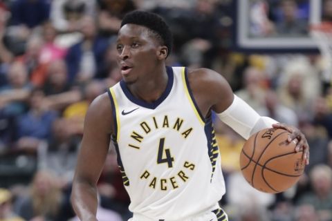 Indiana Pacers guard Victor Oladipo (4) plays against the Milwaukee Bucks during the first half of an NBA basketball game in Indianapolis, Wednesday, Dec. 12, 2018. (AP Photo/Michael Conroy)