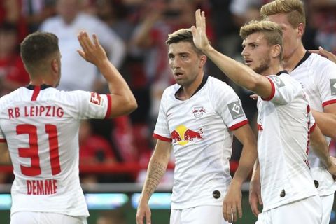 From left, Leipzig's Diego Demme, Kevin Kampl, Timo Werner, Marcel Halstenberg celebrate a goal, during the German Bundesliga soccer match between Union Berlin and RB Leipzig, in Berlin, Sunday, Aug. 18, 2019. (Andreas Gora/dpa via AP)