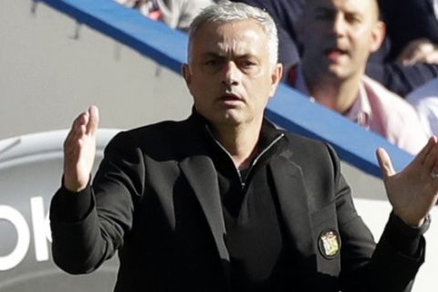 ManU coach Jose Mourinho gives directions to his players during their English Premier League soccer match between Chelsea and Manchester United at Stamford Bridge stadium in London Saturday, Oct. 20, 2018. (AP Photo/Matt Dunham)