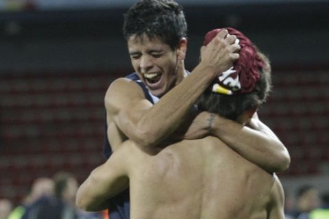 Ezaquiel Luis Ibanez, left, is embraced by teammate after the UEFA Cup first round, second leg soccer match against Sparta Prague at the Axa Arena in Prague, Czech Republic on Thursday Oct. 2, 2008. Dinamo tied with Sparta 3-3 and advanced to a next round on aggregate. (AP Photo/Petr David Josek)