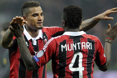 MILAN, ITALY - FEBRUARY 20:  Kevin Prince Boateng and Sulley Muntari of AC Milan celebrate victory at the end of the UEFA Champions League Round of 16 first leg match between AC Milan and Barcelona at San Siro Stadium on February 20, 2013 in Milan, Italy.  (Photo by Claudio Villa/Getty Images)