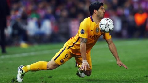 "MADRID, SPAIN - APRIL 13: Luis Suarez of FC Barcelona slips as he stops the ball during the UEFA Champions league Quarter Final Second Leg match between Club Atletico de Madrid and FC Barcelona at Vincente Calderon on April 13, 2016 in Madrid, Spain.  (Photo by Alex Grimm/Bongarts/Getty Images)"
