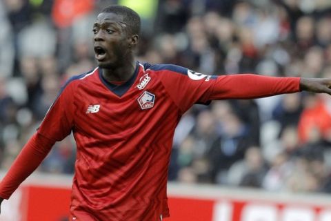 Lille's Nicolas Pepe gestures during his League One soccer match match Lille and Montpellier at the Lille Metropole stadium, in Villeneuve d'Ascq, northern France, Saturday, Feb. 17, 2019. (AP Photo/Michel Spingler)
