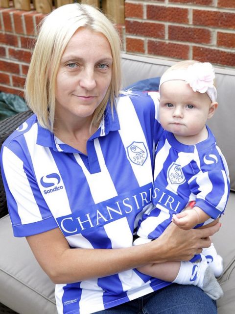 Nicky Rowlinson with baby Charley who are not happy with Sheffield Wednesday's expensive ticket policy. See Ross Parry copy RPYTICKET : SheÕs only seven months old and weighs 17lb Ð but Sheffield Wednesday will charge a staggering £17 for newborn Charley Rawlinson to go to a football match. Huge Owls fans Nicky and Scott Rowlinson are season ticket holders and looked forward to taking their girl to Hillsborough for the first time this season.