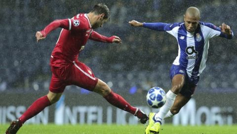Moscow midfielder Grzegorz Krychowiak vies for the ball with Porto midfielder Yacine Brahimi, right, during the Champions League group D soccer match between FC Porto and Lokomotiv Moscow at the Dragao stadium in Porto, Portugal, Tuesday, Nov. 6, 2018. (AP Photo/Manuel Araujo)