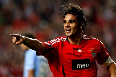 Benfica's Nuno Gomes celebrates after scoring his team's second goal against Napoli during their UEFA Cup first round, second leg, soccer match Thursday, Oct. 2 2008, at the Luz stadium in Lisbon. Benfica defeated Napoli 2-0 to advance in the tournament. (AP Photo/Joao Henriques)