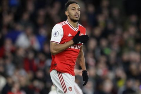 Arsenal's Pierre-Emerick Aubameyang celebrates after scoring his side's third goal during the English Premier League soccer match between Arsenal and Everton at Emirates stadium in London, Sunday, Feb. 23, 2020. (AP Photo/Kirsty Wigglesworth)