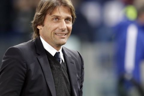 Chelsea coach Antonio Conte smiles prior to the Champions League group C soccer match between Roma and Chelsea, at the Olympic stadium in Rome, Tuesday, Oct. 31, 2017. (AP Photo/Andrew Medichini)