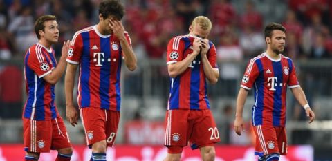 MUNICH, GERMANY - MAY 12:  (L-R) Mario Goetze, Javi Martinez, Sebastian Rode and Juan Bernat of Bayern Muenchen look on aafter elimination the UEFA Champions League semi final second leg match between FC Bayern Muenchen and FC Barcelona at Allianz Arena on May 12, 2015 in Munich, Germany.  (Photo by Matthias Hangst/Bongarts/Getty Images)