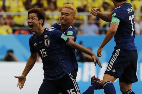 Japan's Yuya Osako celebrates scoring his side's second goal during the group H match against Colombia at the 2018 soccer World Cup in the Mordavia Arena in Saransk, Russia, Tuesday, June 19, 2018. (AP Photo/Eugene Hoshiko)