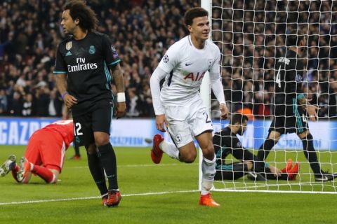 Tottenham's Dele Alli, right, celebrates after scoring the opening goal during the soccer Champions League group H match between Tottenham and Real Madrid in London, Wednesday, Nov. 1, 2017. (AP Photo/Frank Augstein)