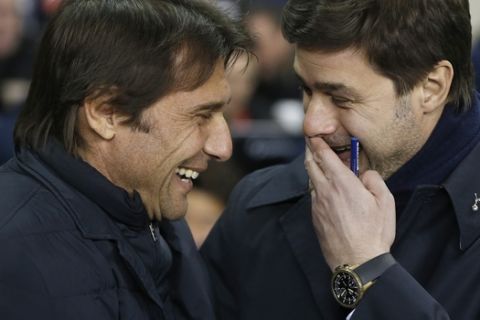 Chelsea's manager Antonio Conte, left, and Tottenham's manager Mauricio Pochettino smile together ahead of the English Premier League soccer match between Tottenham Hotspur and Chelsea at White Hart Lane stadium in London, Wednesday, Jan. 4, 2017. (AP Photo/Alastair Grant)