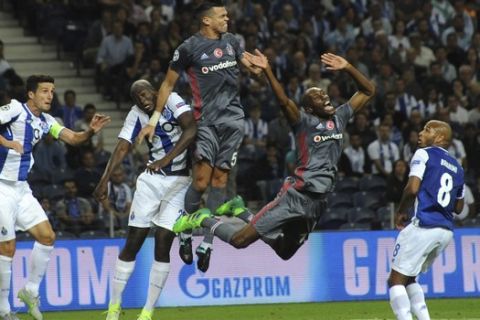 Besiktas' Pepe, center, jumps for the ball during the Champions League group G soccer match between FC Porto and Besiktas at the Dragao stadium in Porto, Portugal, Wednesday, Sept. 13, 2017. (AP Photo/Paulo Duarte)