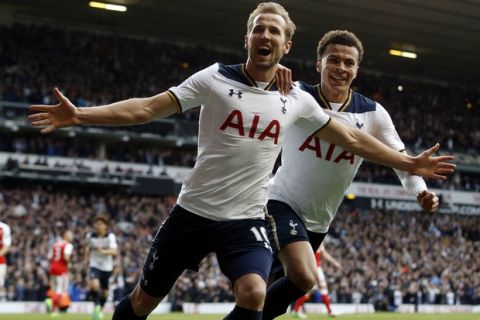 Tottenham Hotspur's Harry Kane, front, celebrates after scoring a penalty during the English Premier League soccer match between Tottenham Hotspur and Arsenal at White Hart Lane in London, Sunday, April 30, 2017. (AP Photo/Alastair Grant)