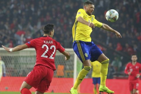 Sweden's Marcus Berg, right, heads the ball ahead of Turkey's Kaan Ayhan during the UEFA Nations League soccer match between Turkey and Sweden in Konya, Turkey, Saturday, Nov. 17, 2018. (AP Photo)