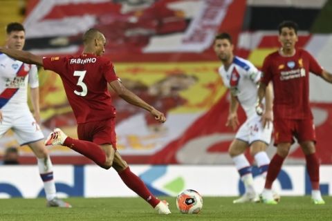 Liverpool's Fabinho scores his side's third goal during the English Premier League soccer match between Liverpool and Crystal Palace at Anfield Stadium in Liverpool, England, Wednesday, June 24, 2020. (Shaun Botterill/Pool via AP)