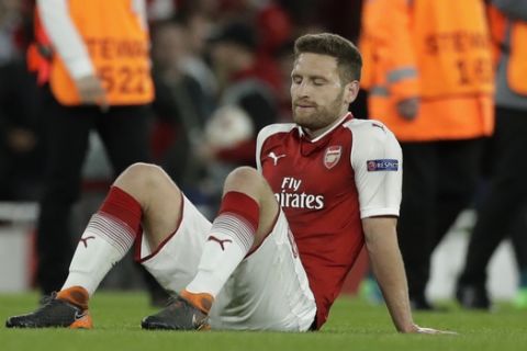 Arsenal's Shkodran Mustafi reacts after the Europa League semifinal first leg soccer match between Arsenal FC and Atletico Madrid at Emirates Stadium in London, Thursday, April 26, 2018. The match ended 1-1. (AP Photo/Matt Dunham)
