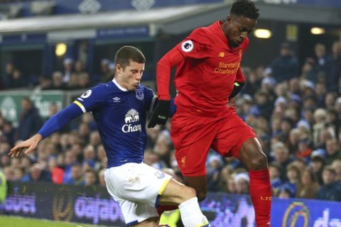 FILE - This is a Monday, Dec. 19, 2016  file photo of Liverpool's Divock Origi, right, competes for the ball with Everton's Ross Barkley during the English Premier League soccer match between Everton and Liverpool at Goodison Park stadium in Liverpool, England . Everton's derby on Saturday April 1, 2017,  against neighbor Liverpool, which is one of the sides fighting to clinch a place in Europes top competition. Everton would move to within three points of fourth-place Liverpool with a win at Anfield. (AP Photo/Dave Thompson/File)