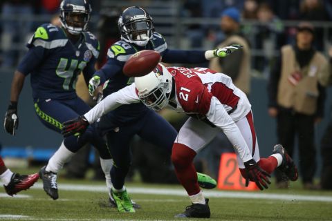 SEATTLE, WA - DECEMBER 09:  Punt returner Patrick Peterson #21 of the Arizona Cardinals fumbles a punt against the Seattle Seahawks at CenturyLink Field on December 9, 2012 in Seattle, Washington. The Seahawks recovered for a touchdown on the play.  (Photo by Otto Greule Jr/Getty Images)