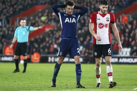 Tottenham's Dele Alli, center, reacts after missing a shot at goal during the English Premier League soccer match between Southampton and Tottenham Hotspur at the St Mary's Stadium in Southampton, England, Sunday, Jan. 21, 2008.(AP Photo/Frank Augstein)