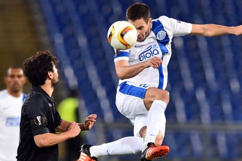 Dnipropetrovsk's midfielder from Ukraine Yevhen Shakhov heads the ball during the UEFA Europa League football match between Lazio Rome and FK Dnipro Dnipropetrovsk, on November 26, 2015 at the Olympic stadium in Rome.  AFP PHOTO / GABRIEL BOUYS / AFP / GABRIEL BOUYS        (Photo credit should read GABRIEL BOUYS/AFP/Getty Images)