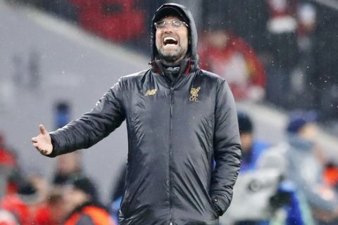 Liverpool coach Juergen Klopp shouts during the Champions League round of 16 second leg soccer match between Bayern Munich and Liverpool in Munich, Germany, Wednesday, March 13, 2019. (AP Photo/Matthias Schrader)