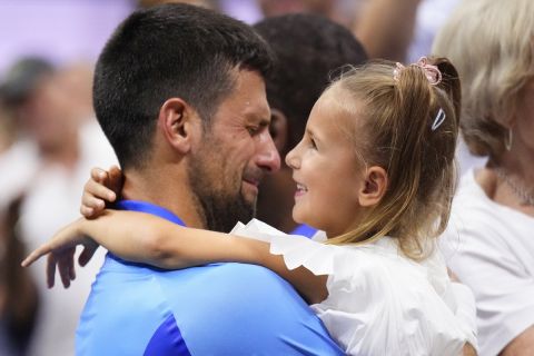 Novak Djokovic, of Serbia, celebrates with his daughter Tara after defeating Daniil Medvedev, of Russia, in the men's singles final of the U.S. Open tennis championships, Sunday, Sept. 10, 2023, in New York. (AP Photo/Manu Fernandez)