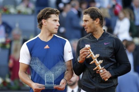 Spain's Rafael Nadal, right, and Dominic Thiem of Austria, hold their trophies after Nadal won the final of the Madrid Open tennis tournament in two sets, 7-6 (10-8), 6-4, in Madrid, Spain, Sunday, May 14, 2017. (AP Photo/Daniel Ochoa de Olza)