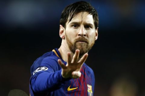 Barcelona's Lionel Messi gestures after scoring the opening goal during the Champions League round of sixteen second leg soccer match between FC Barcelona and Chelsea at the Camp Nou stadium in Barcelona, Spain, Wednesday, March 14, 2018. (AP Photo/Manu Fernandez)