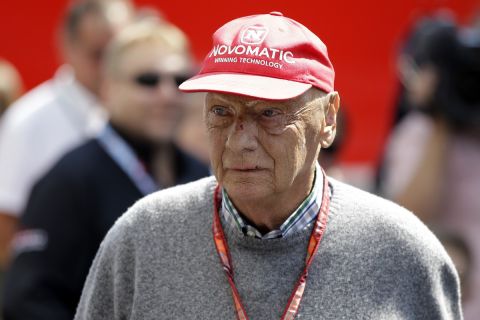 FILE - In this July 7, 2018 file photo former Formula One World Champion Niki Lauda of Austria walks in the paddock before the third free practice at the Silverstone racetrack, Silverstone, England. The three-time Formula One world champion Niki Lauda has died at the age of 70. (AP Photo/Luca Bruno, file)
