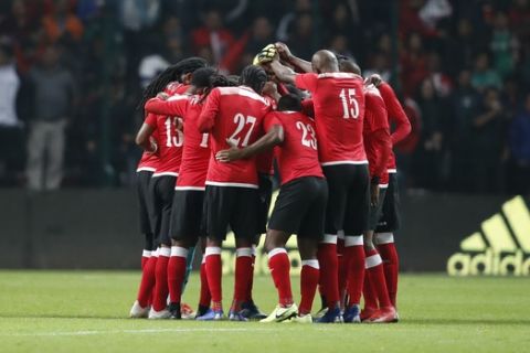 Trinidad and Tobago's soccer players huddle before the start of their friendly soccer match against Mexico at Nemesio Diez Stadium in Toluca, Mexico, Wednesday, Oct. 2, 2019. (AP Photo/Eduardo Verdugo)