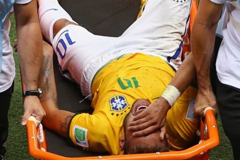 FORTALEZA, BRAZIL - JULY 04:  Neymar of Brazil is stretchered off the field after a challenge during the 2014 FIFA World Cup Brazil Quarter Final match between Brazil and Colombia at Castelao on July 4, 2014 in Fortaleza, Brazil.  (Photo by Michael Steele/Getty Images)