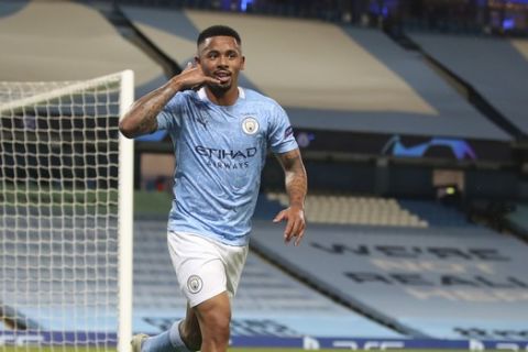 Manchester City's Gabriel Jesus gestures as he celebrates after scoring during the Champions League round of 16, second leg soccer match between Manchester City and Real Madrid at the Etihad Stadium in Manchester, England, Friday, Aug. 7, 2020. (Nick Potts/Pool Photo via AP)