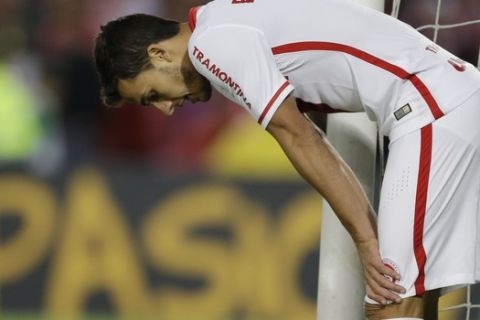 Nilmar of Brazil's Internacional looks down after missing a shot on goal during a Copa Libertadores quarter finals first leg soccer match against Colombia's Independiente Santa Fe in Bogota, Colombia, Wednesday, May 20, 2015. Santa Fe won the match 1-0. (AP Photo/Ricardo Mazalan)