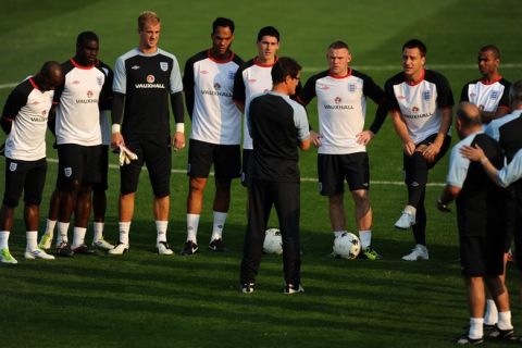 England Head Coach Fabio Capello (C) talks to his players during a training session in Sofia on September 1, 2011 ahead of their  Euro 2012 qualifier match against Bulgaria.       AFP PHOTO / DIMITAR DILKOFF (Photo credit should read DIMITAR DILKOFF/AFP/Getty Images)