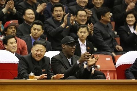 North Korean Leader Kim Jong Un, seated next to former NBA star Dennis Rodman (in black cap), at a basketball game Thursday in Pyongyang.