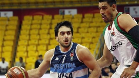 Argentina's Facundo Campazzo drives past Mexico's Gustavo Ayon during a FIBA World Cup qualifying basketball game in Caracas, Venezuela, Tuesday, Sept. 10, 2013. (AP Photo/Ariana Cubillos)