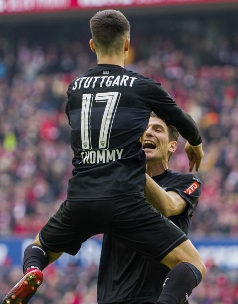 Stuttgart's Mario Gomez, right, celebrates with Erik Thommy  during the German Bundesliga soccer match between 1. FC Cologne and VfB Stuttgart in Cologne, Germany, Sunday, March 4, 2018. (Rolf Vennenbernd/dpa via AP)