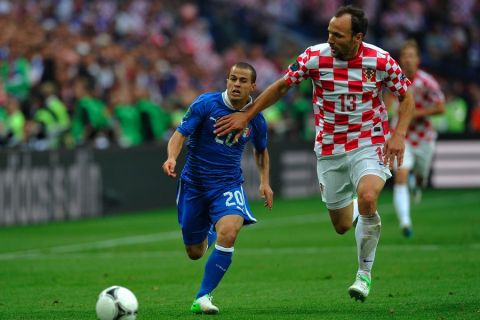 Warsaw 14/06/2012.POLAND, POZNAN.Italy's Sebastian Giovinco fights for the ball with Gordon Schildenfeld of Croatia during the Euro 2012 football championships match Italy v Croatia , on June 14, 2012 at the stadium in Poznan. .Photo by: Piotr Hawalej / WROFOTO