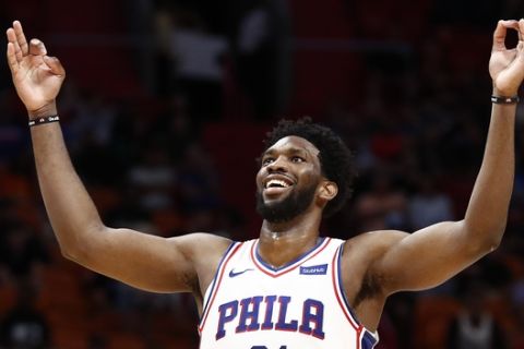 Philadelphia 76ers center Joel Embiid celebrates after scoring a three point basket in the second half of an NBA basketball game against the Miami Heat on Monday, Nov. 12, 2018, in Miami. (AP Photo/Brynn Anderson)