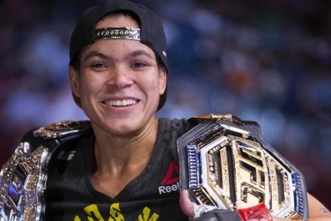 Amanda Nunes smiles after victory over Holly Holm during their women's bantamweight mixed martial arts title bout at UFC 239 on Saturday, July 6, 2019, in Las Vegas. Nunes won by first-round knockout. (AP Photo/Eric Jamison)