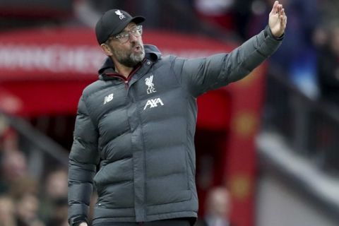 Liverpool's manager Jurgen Klopp gestures during the English Premier League soccer match between Manchester United and Liverpool at the Old Trafford stadium in Manchester, England, Sunday, Oct. 20, 2019. (AP Photo/Jon Super)