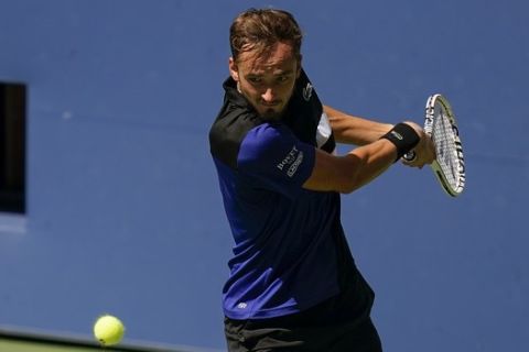 Daniil Medvedev, of Russia, returns a shot to J.J. Wolf, of the United States, during the third round of the US Open tennis championships, Saturday, Sept. 5, 2020, in New York. (AP Photo/Seth Wenig)