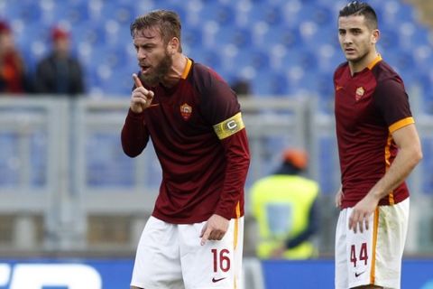 Romas Daniele De Rossi, left, and his teammate Kostas Manolas wait for referee's whistle after Atalantas Alejandro Gomez scored during a Serie A soccer match between Roma and Atalanta, at Rome's Olympic stadium, Sunday, Nov. 29, 2015. (AP Photo/Riccardo De Luca)