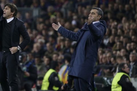 Chelsea coach Antonio Conte, left, and Barcelona coach Ernesto Valverde, right, gesture during the Champions League round of sixteen second leg soccer match between FC Barcelona and Chelsea at the Camp Nou stadium in Barcelona, Spain, Wednesday, March 14, 2018. (AP Photo/Emilio Morenatti)